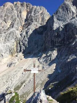A mountain cross on the top Stock Photos