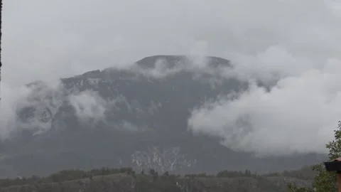 Mountain disappearing in white mist Stock Footage 158761317