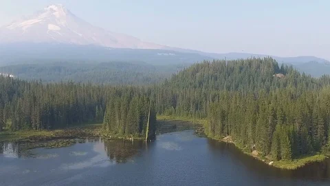 Mountain in distance flying over lake Stock Footage 102740798