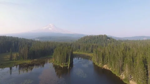 Mountain in distance flying over lake Stock Footage 102740799