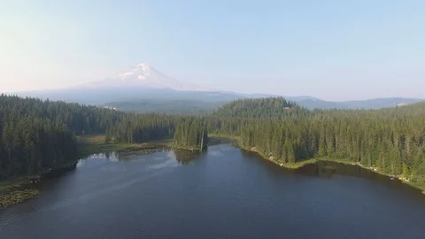 Mountain in distance flying over lake Stock Footage 102740931