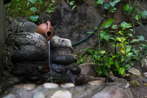 Mountain drinking spring pours from a jug, Georgia Stock Photos