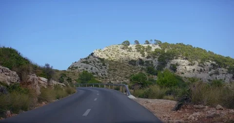 Mountain Drive. POV from the drivers perspective through a winding mountain road Stock Footage 78621298