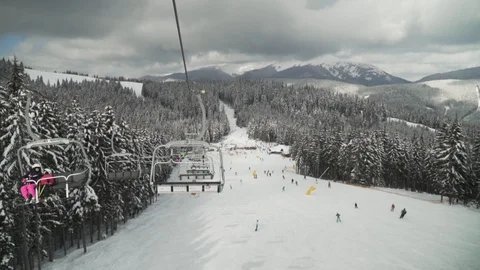 Mountain elevator at winter resort with POV view skiers 動画素材 101187109