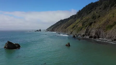 Mountain ends and ocean begins Stock Footage 152862854