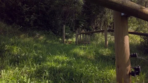 Mountain fence at the trees shadow Stock Footage 134782551