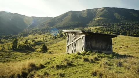 Mountain Field with Alpine Hut in Warm Moody Light, Italian Alps Video stock 316833500