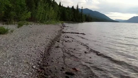 Mountain Forest Beach Slow Drone Fly over at sunset Stock Footage 125990647