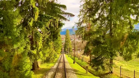 The mountain funicular descends by cable car from the mountains. Stock Footage 260235003