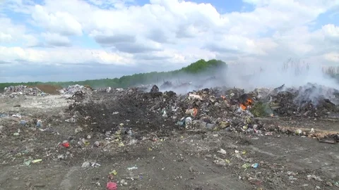 Mountain of garbage. Smoke. Environmental pollution Stock Footage 76394952