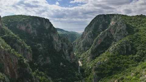 Mountain Gorge Opening Toward Sea in Greece Stock Footage 336563649