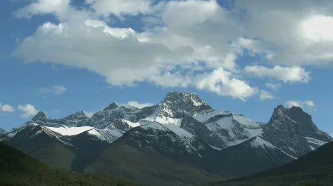 Mountain group with time lapse clouds 3 Stock Footage 128877