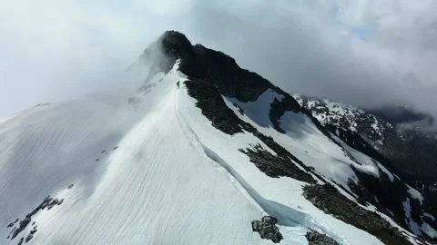 The Mountain hiding in the clouds reveals itself, Aerial View Stock Footage 289556554