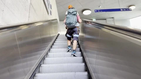 Mountain Hikers with Backpack Travel on an Escalator in City Stock Footage 284114792