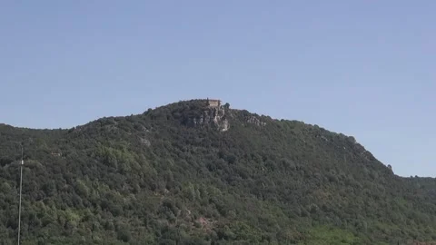 Mountain hill peak trees chapel church medieval stone countryside nature Am.. Stock Footage 330952055