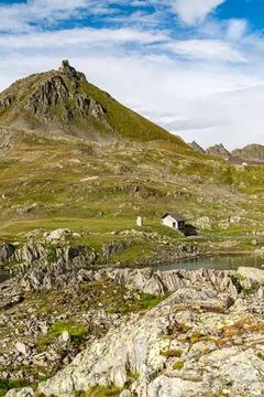 A mountain with a house on top of it Stock Photos