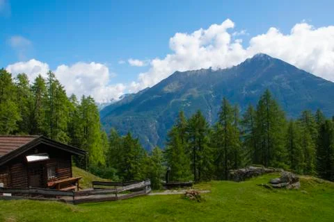 Mountain hut and clouds Stock Photos