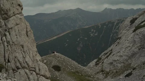 Mountain Hut Between the Rocks 4K Stock Footage 67477737