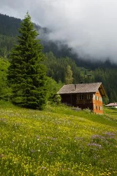 Mountain hut with clouds Stock Photos