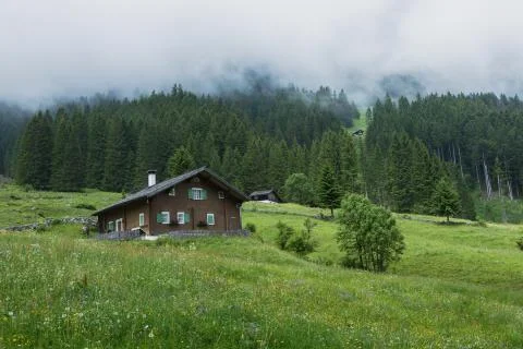 Mountain hut on a cloudy day Stock Photos