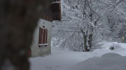 Mountain Hut Snowing Trees Handheld 4K Stock Footage 59775106