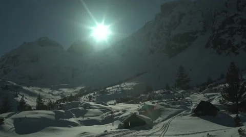 Mountain Hut Snowy Peaks Sun Glare Static 4K Stock Footage 59776357