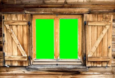 Mountain hut window green screen Stock Photos
