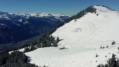 A mountain hut in the winter alps Stock Footage 164914478