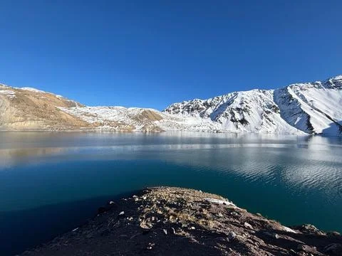 Mountain Lagoon with Reflected Snow Stock Photos