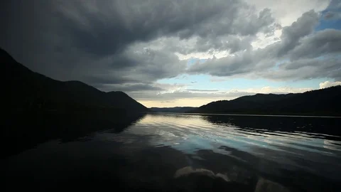 Mountain lake with beautiful reflection. Low Flight Above Lake Stockbeeldmateriaal 83890507