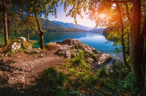Mountain lake between by mountains Stock Photos