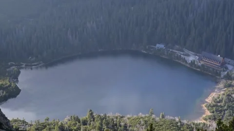Mountain lake in between mountains from the top of mountain Stock Footage 132251396