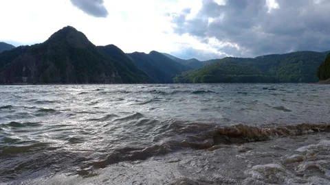 Mountain lake with big waves caused by wind. Slow motion Video stock 161802675