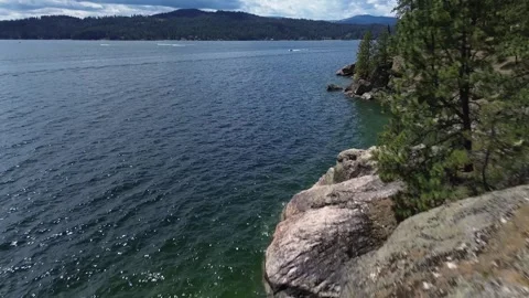 Mountain Lake Coast w/ Boats Establishing 4K Drone Shot 스톡 동영상 279098053
