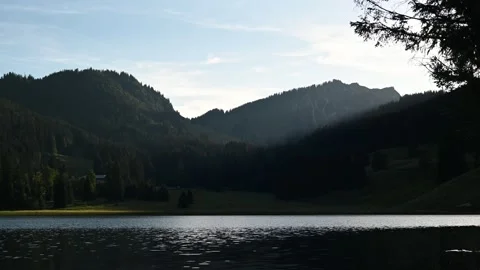 A mountain lake in the evening Video stock 217379997