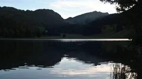 A mountain lake in the evening 스톡 동영상 217380151