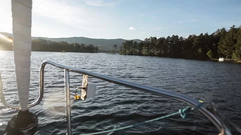 Mountain Lake. Forest in the water. View from the boat Video stock 64464071