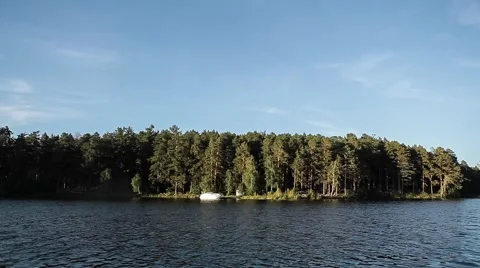 Mountain Lake. Forest in the water. View from the boat Stock Footage 64464265