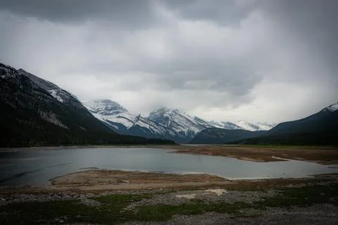 Mountain lake landscape under a dramatic sky Stock Photos