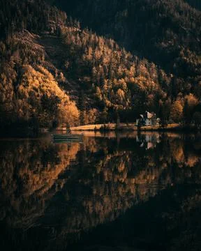 Mountain lake langbathsee with reflection in upper austria during sunset Stock Photos