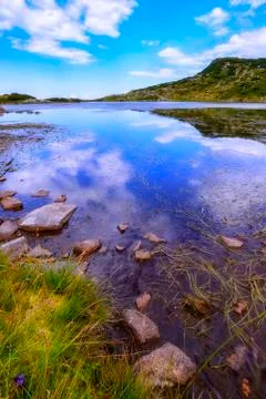 Mountain lake with the reflection Stock Photos