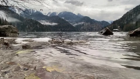 Mountain Lake Ritsa in Abkhazia. Bottom view from water on Caucasus Mountains Stock Footage 276588853
