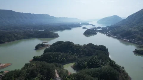 Mountain Lake with Scattered Islands Cliffs Forests and Bays Aerial Stock Footage 320727993