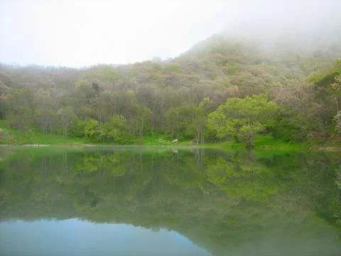 Mountain lake in the spring. Stock Photos