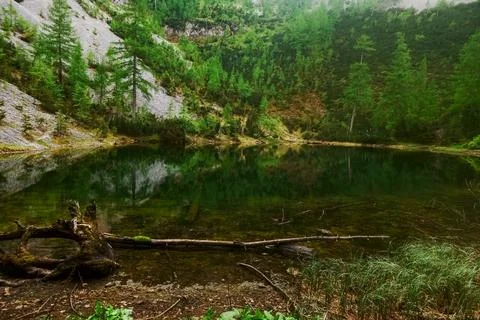Mountain lake on the summit from a mountain while hiking Foto stock