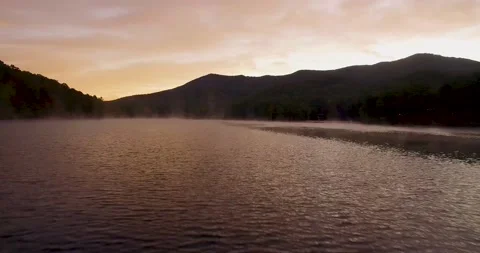Mountain lake at sunrise Stock Footage