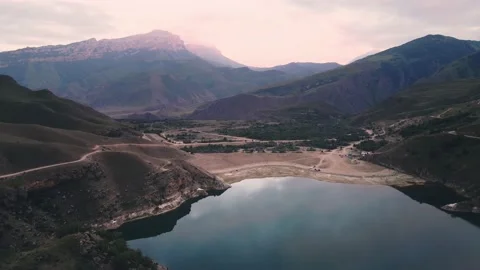 Mountain lake at sunset. Gizhgit lake in North Caucasus, Russia. Stock Footage 232197112