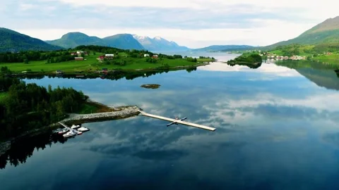 Mountain lake view, 4k drone nature, peaceful lakeside village Video stock 309271906