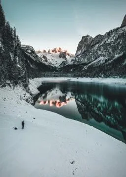 Mountain lake in Winter with Reflection during Sunset Stock Photos