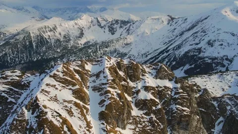 Mountain landscape and vast valleys. Cloudscape over snow-capped cliffs. Alas Stock Footage 331402964
